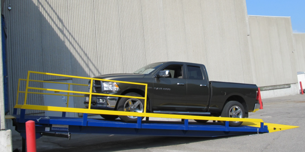 Ground to Dock (GTD) Series Loading Dock Ramp with a pickup truck on it.